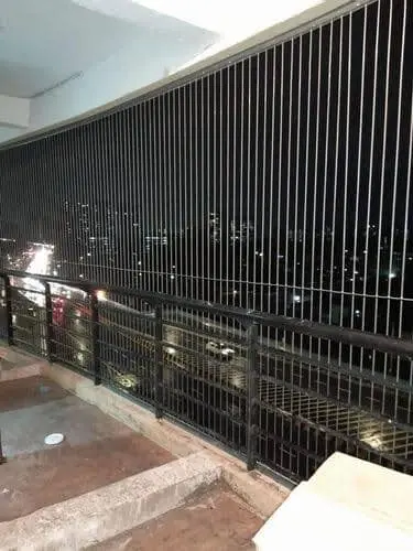 Modern invisible window grill design for residential apartments in Kondapur, Hyderabad.Affordable and strong invisible grills for balconies in Ameenpur