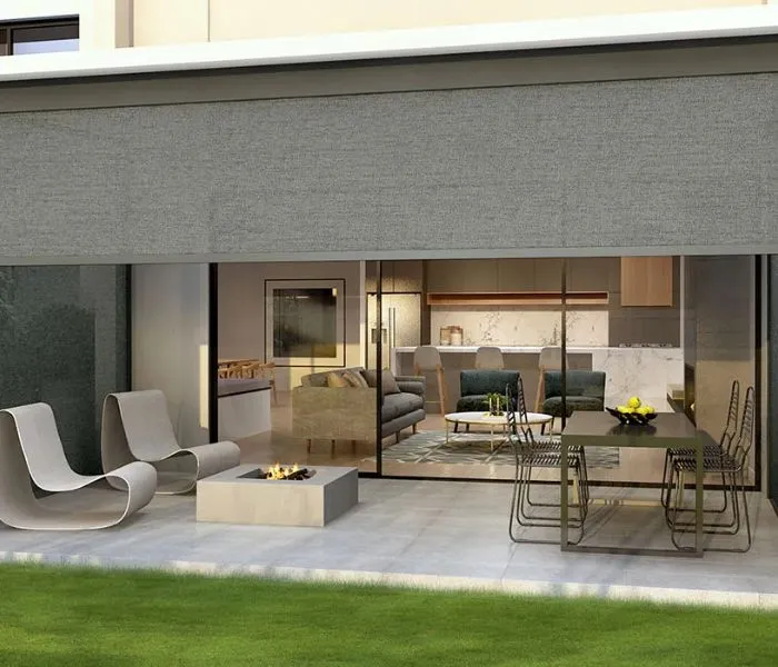 Motorized outdoor zip screens installed on a patio for sun and rain protection