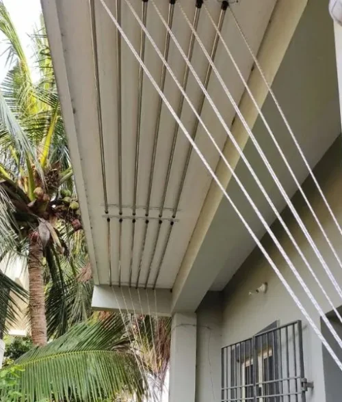 Detailed close-up of the smooth pulley-and-rope mechanism of an SS ceiling cloth hanger. The high-grade stainless steel brackets and durable nylon ropes demonstrate the heavy-load capacity and rust-proof build of the balcony drying system.